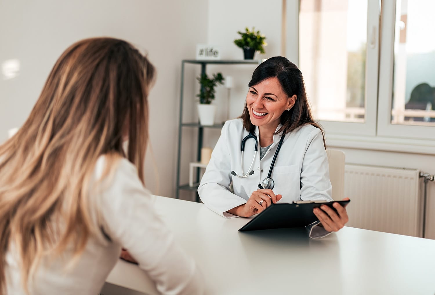 Women consulting with doctor