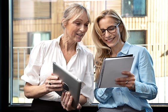 Program Quality and Evaluation Two women looking at notepads