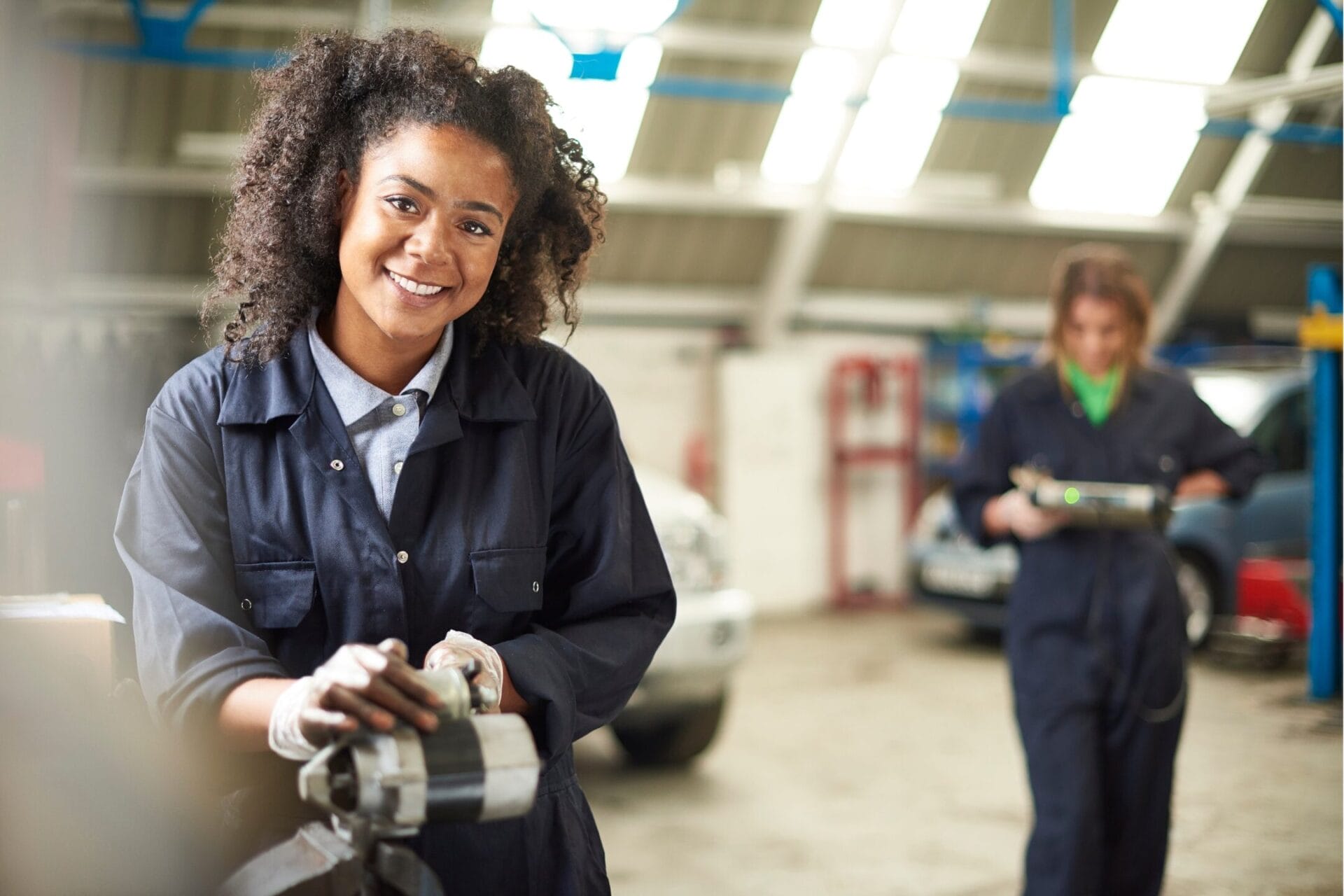 Automotive Scholarships Two women mechanics taking part in a WLA scholarship