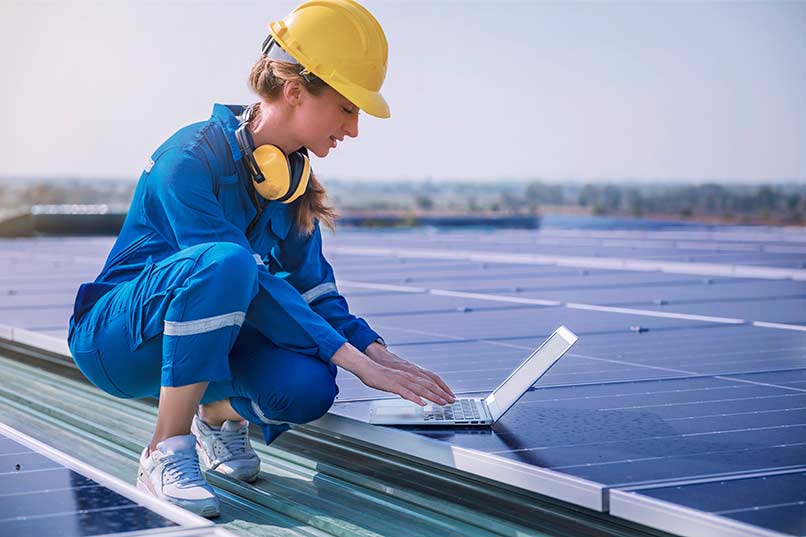 Women working on solar panel
