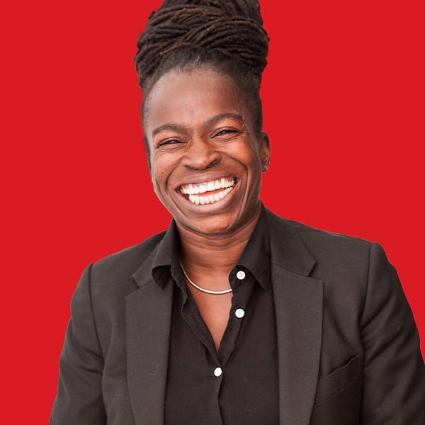 A headshot of Luli Adeyemo in a red background