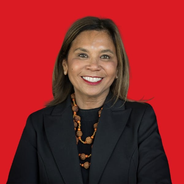 A headshot of Terri Janke in a red background