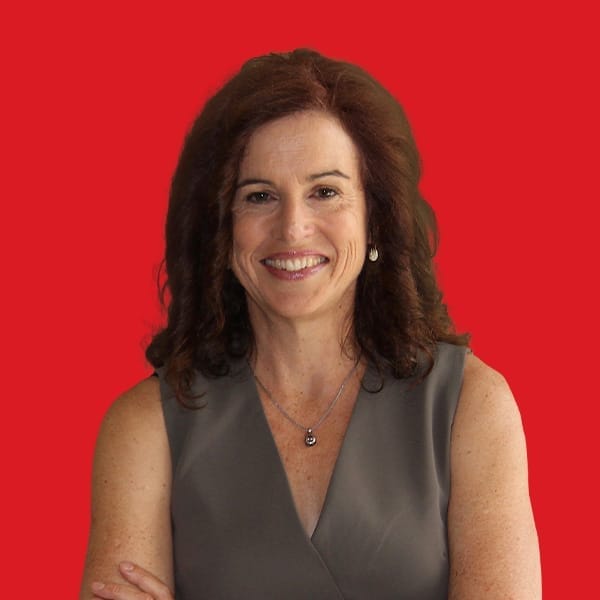 A headshot of Thea O'Connor in a red background