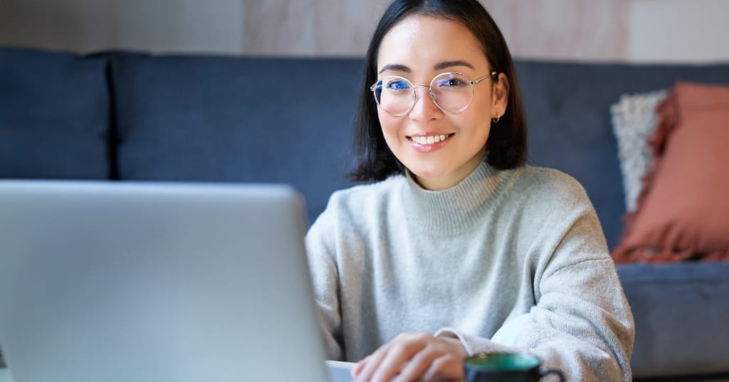 A young lady working on a laptop