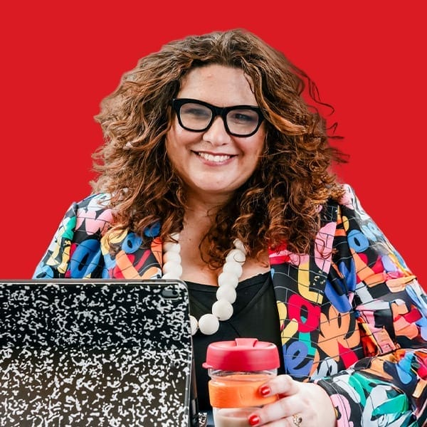 A headshot of Tanja Kovac in a red background