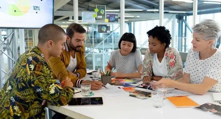 Diverse businesspeople in brainstorm meeting