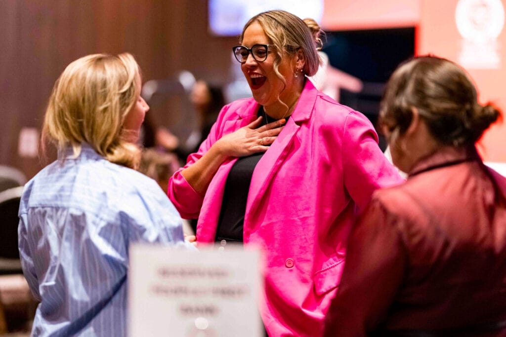 Samantha Carlton talks to an attendee at the Australian Women's Leadership Symposium