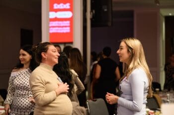 Symposium participants having a conversation