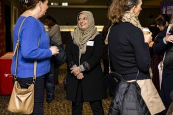 Symposium participants chatting among themselves